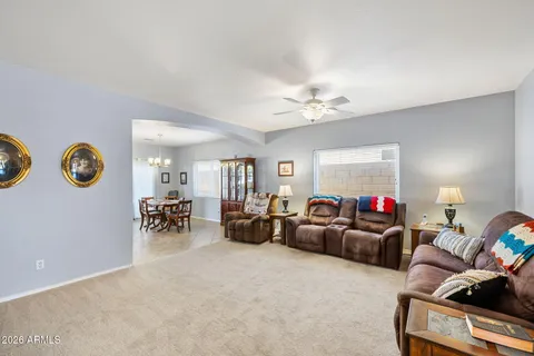 a living room with furniture a couch and a window