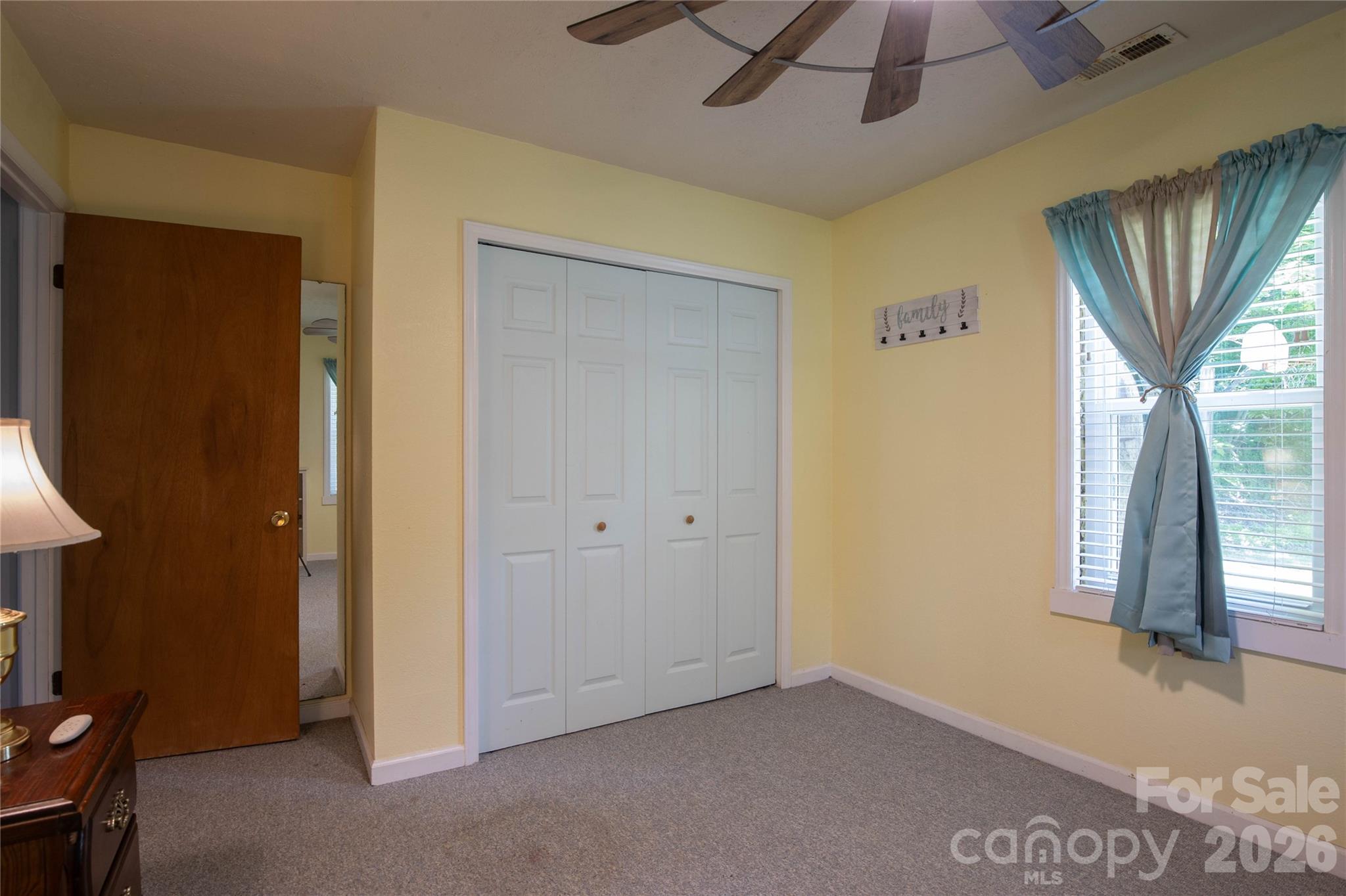 84 Sheets Farm Road Bakersville, NC 28705 - Photo 27 of 42 a view of livingroom with hardwood floor and window