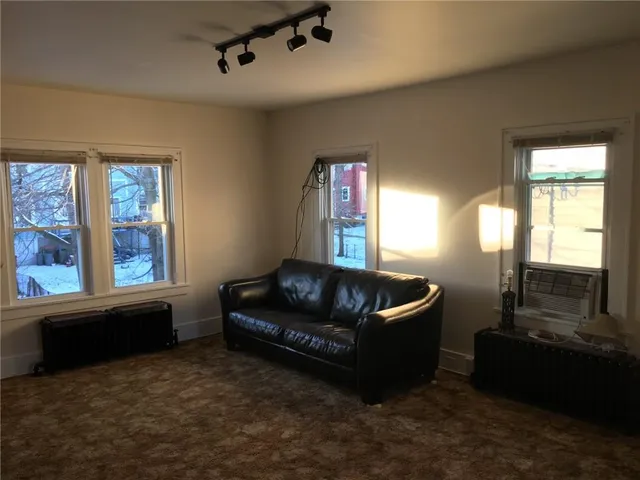a living room with furniture and windows