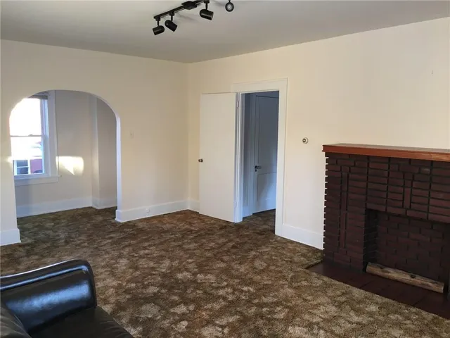 a view of an empty room and window