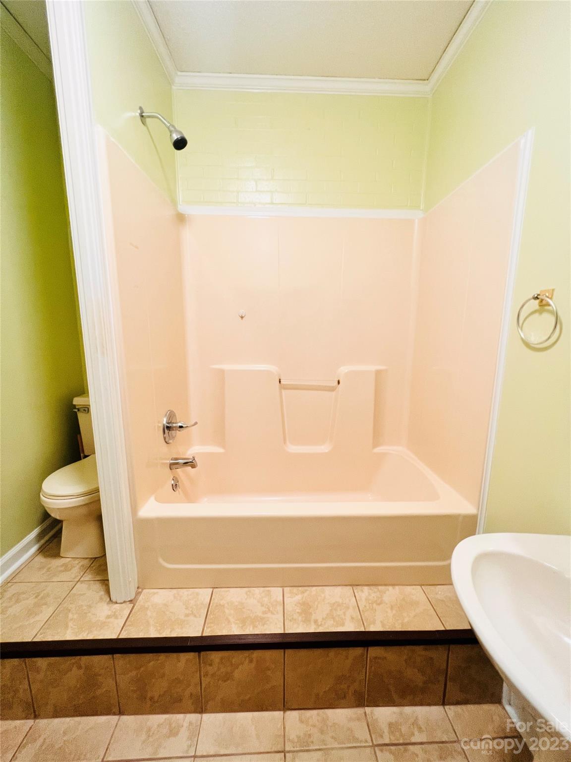 207 7th Avenue Southwest Conover, NC 28613 - Photo 11 of 12 a bathroom with a bathtub and a toilet