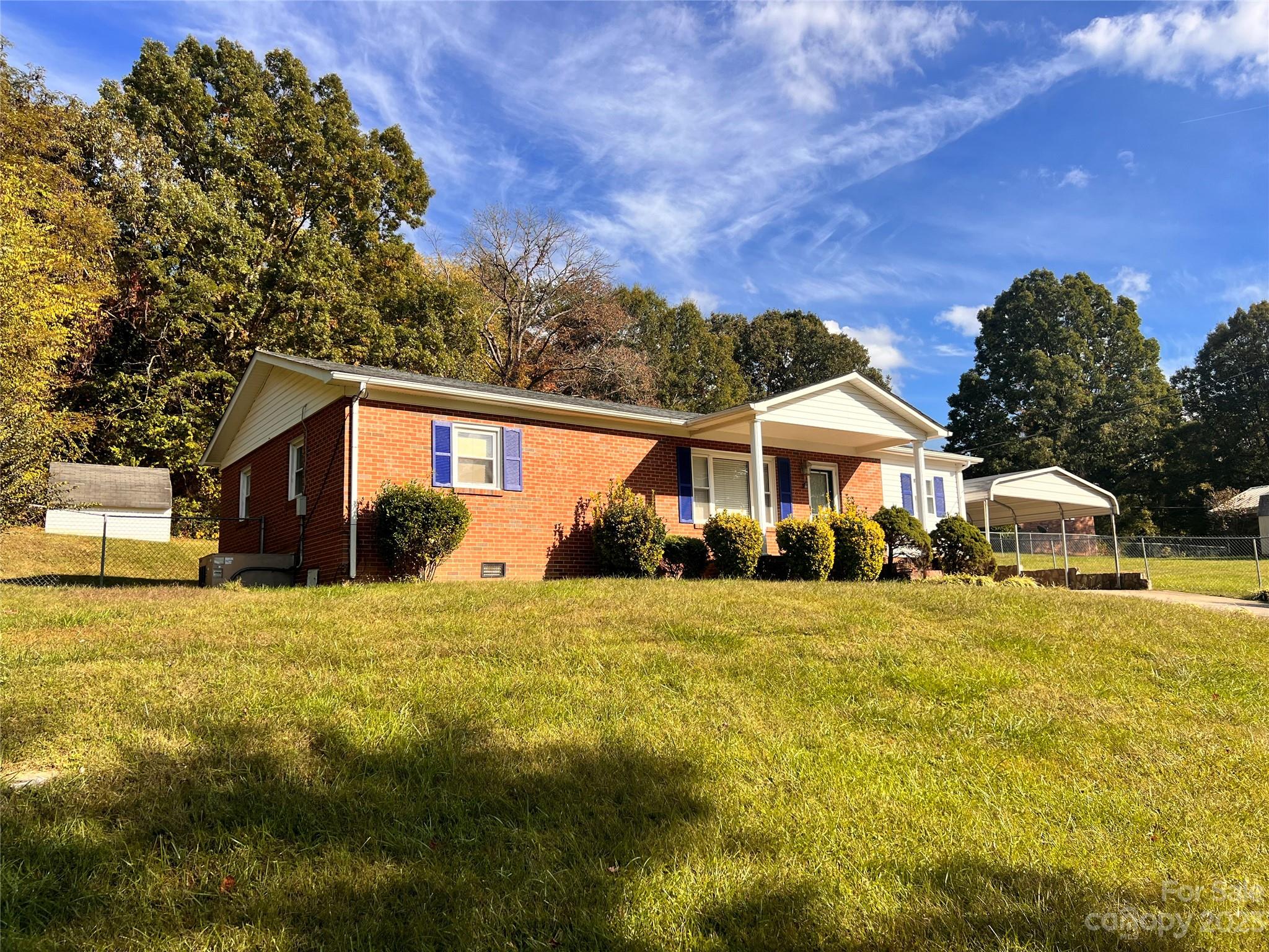 207 7th Avenue Southwest Conover, NC 28613 - Photo 2 of 12 a front view of a house with a yard
