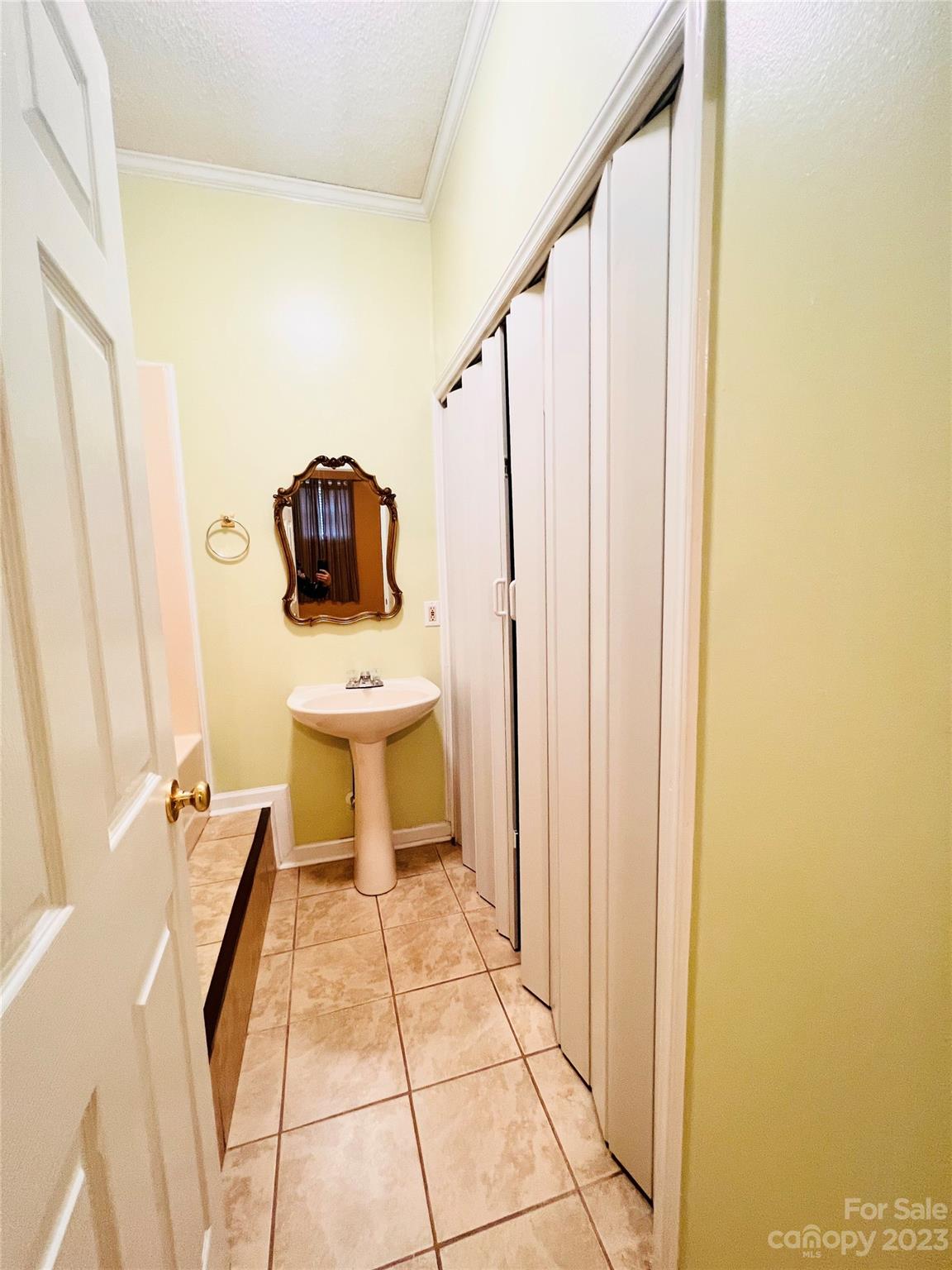 207 7th Avenue Southwest Conover, NC 28613 - Photo 8 of 12 a bathroom with a sink and a mirror