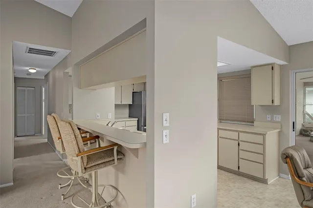 a living room with furniture and a lamp