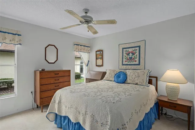 a view of room with window and ceiling fan