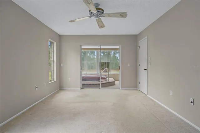 a front view of a house with a yard and plants