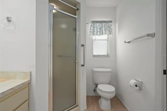 a swimming pool with outdoor seating and yard