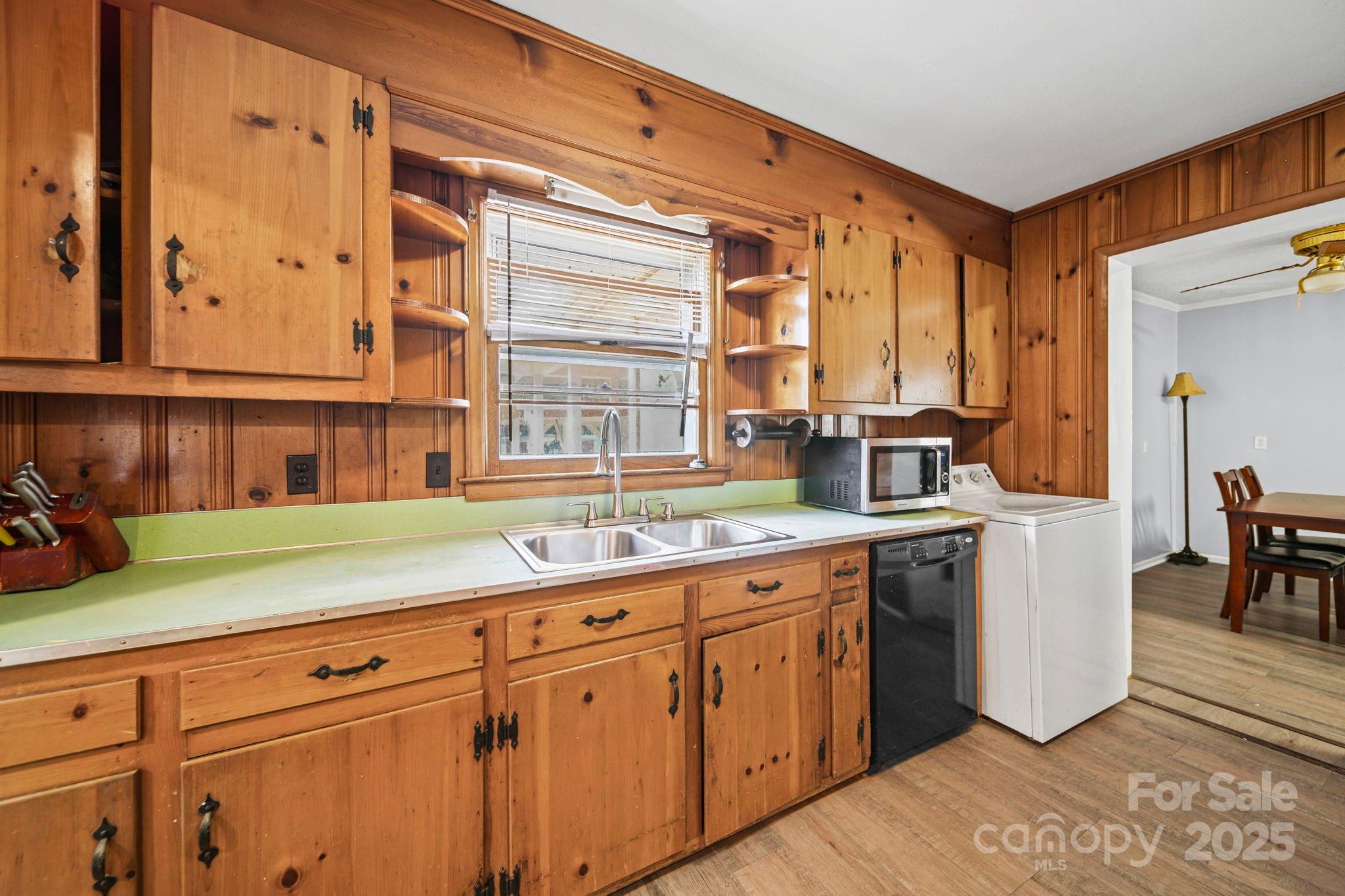 1703 East Perry Street Gastonia, NC 28054 - Photo 14 of 30 a kitchen with a sink and cabinets