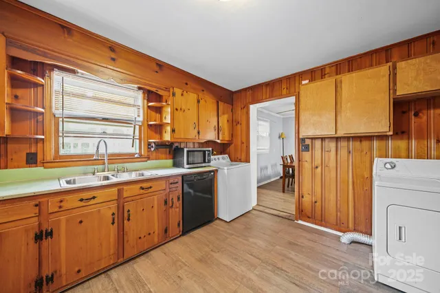 a kitchen with a sink and refrigerator