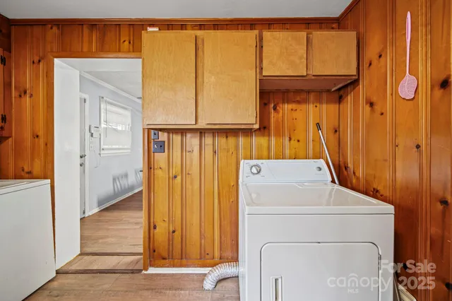 a view of a storage & utility room with a window