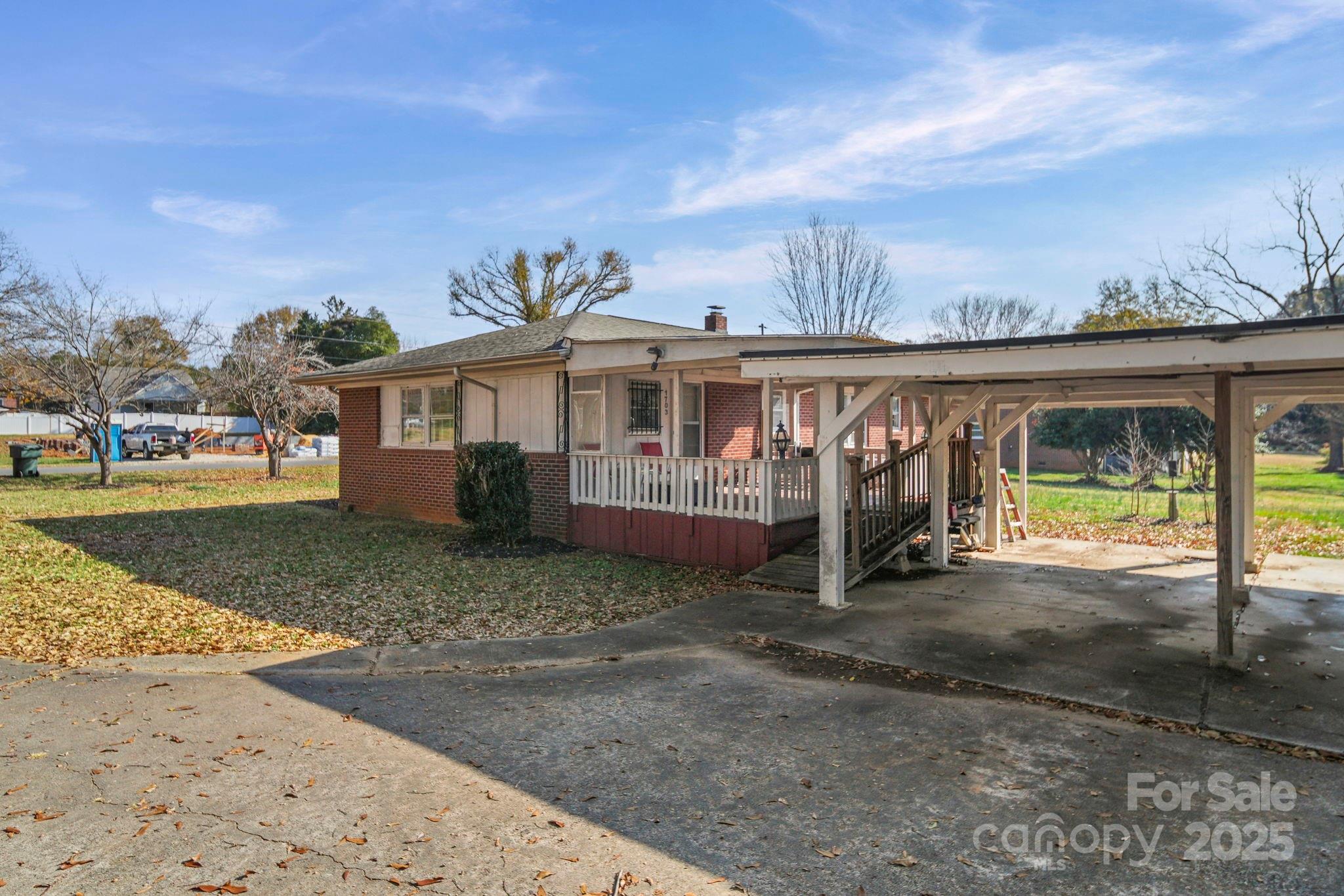 1703 East Perry Street Gastonia, NC 28054 - Photo 24 of 30 a view of a house with a yard