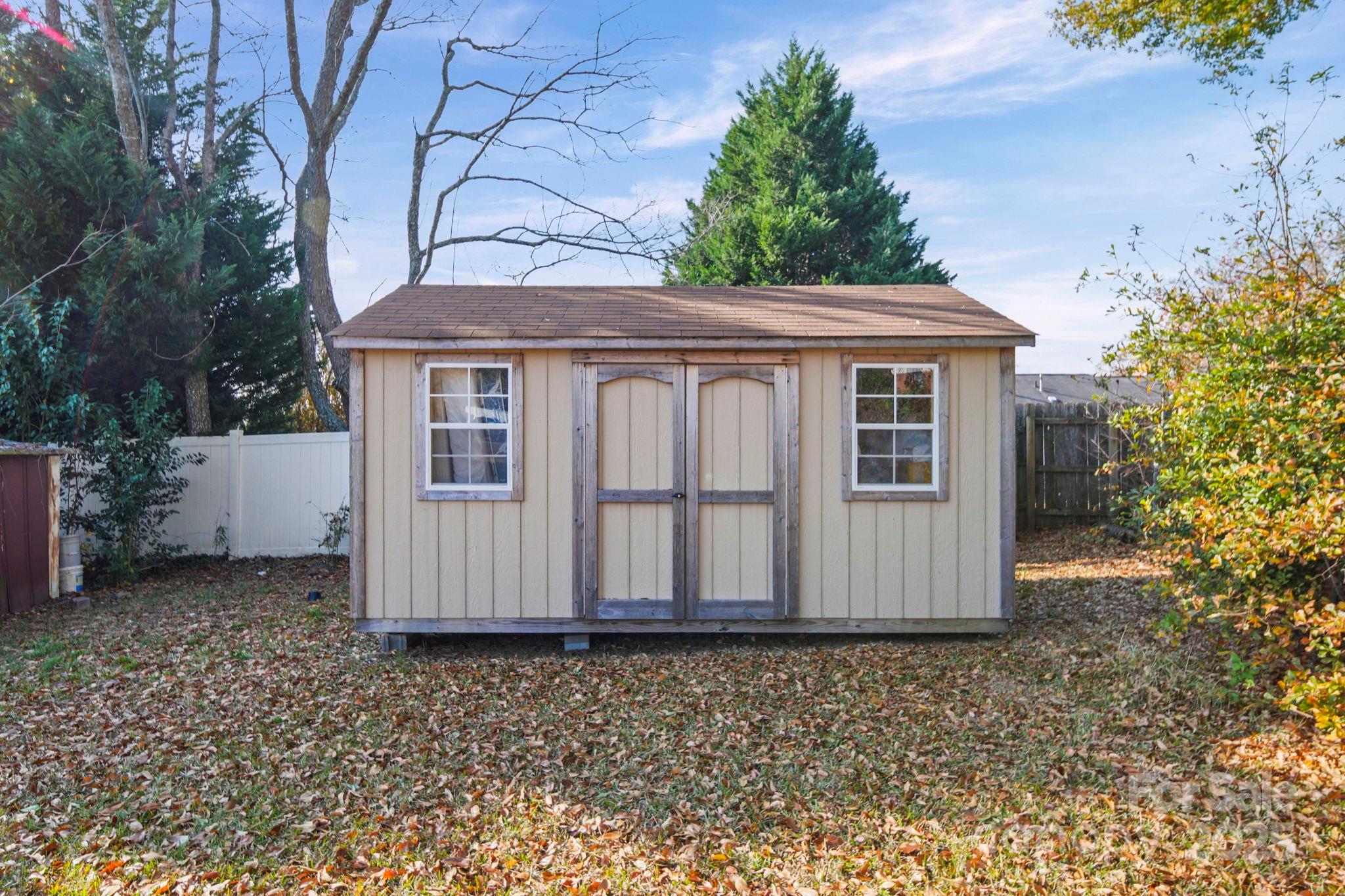 1703 East Perry Street Gastonia, NC 28054 - Photo 25 of 30 a house with a white fence