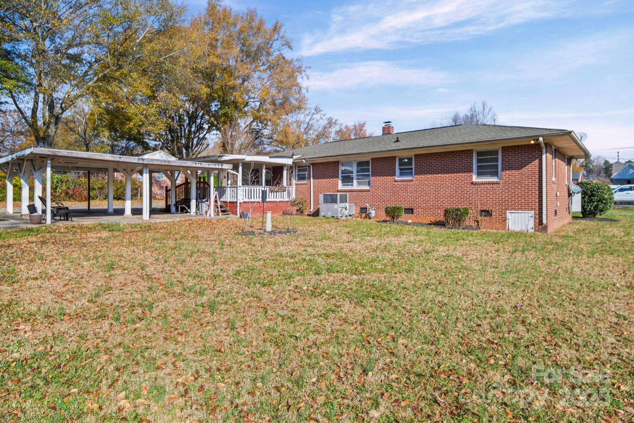 1703 East Perry Street Gastonia, NC 28054 - Photo 27 of 30 a front view of a house with a yard