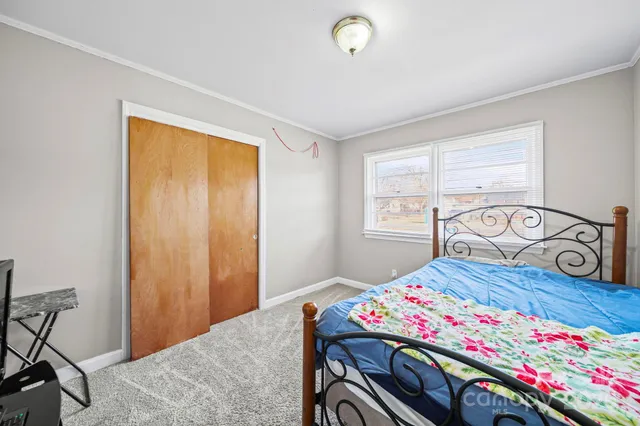 a bedroom with a bed and a table in it