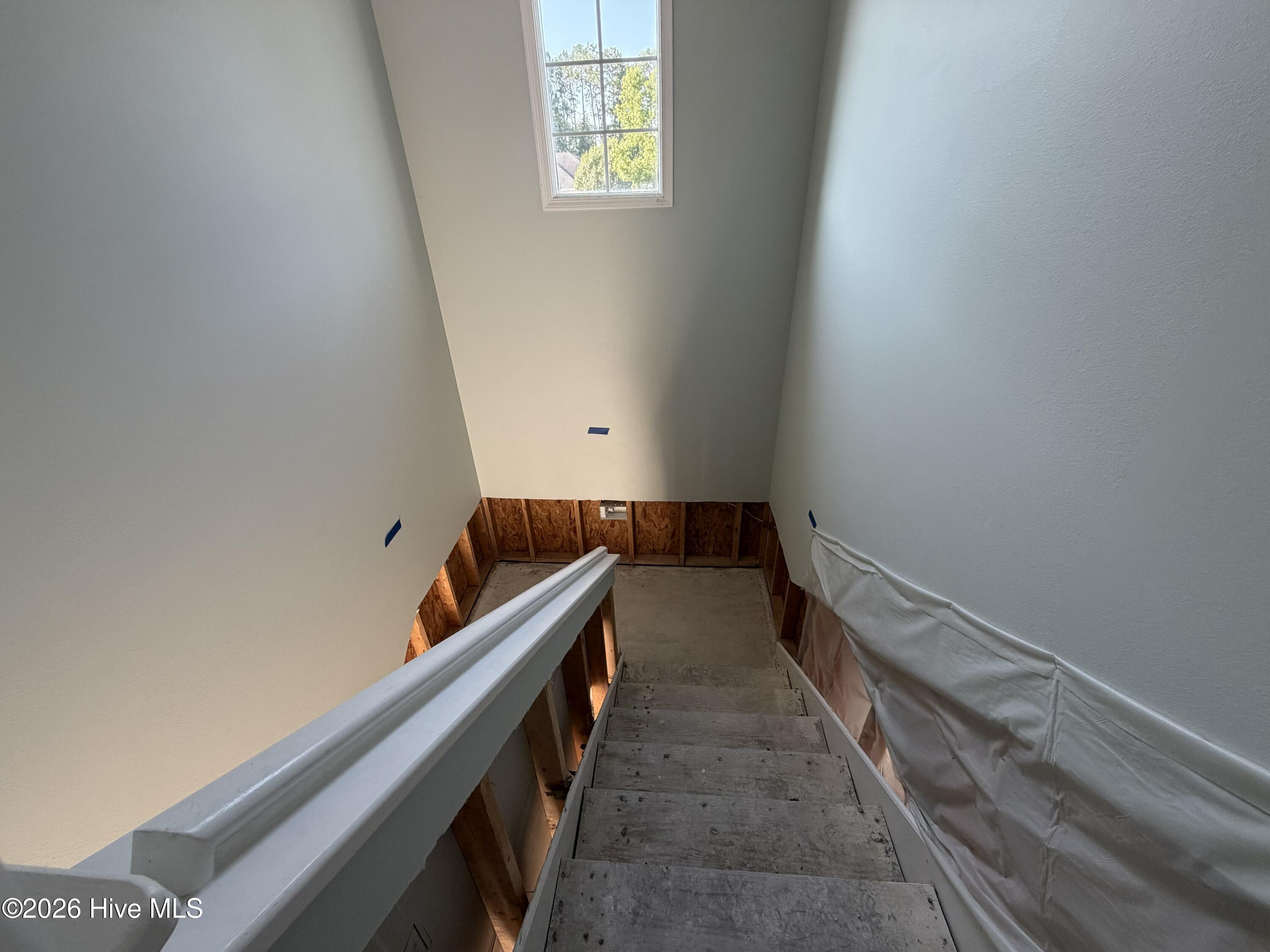 116 Rice Mill Circle, Unit 4 Sunset Beach, NC 28468 - Photo 24 of 29 Inside staircase from unit to ground floor entrance/exit.