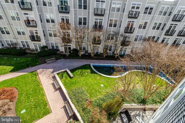 a view of swimming pool from a balcony