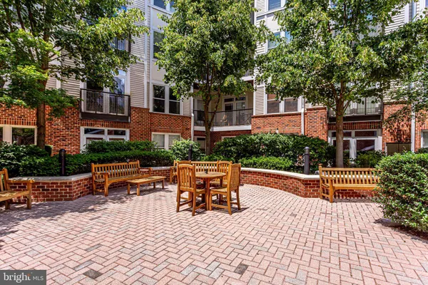 a chairs and bench in front of a building