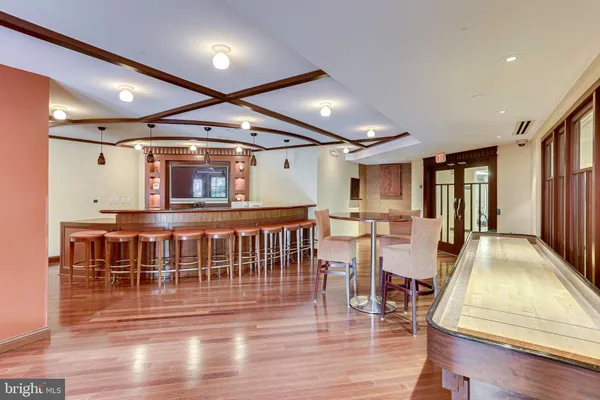 a view of a lobby with furniture and wooden floor