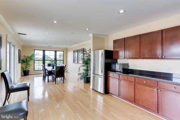 a kitchen with granite countertop cabinets and stainless steel appliances
