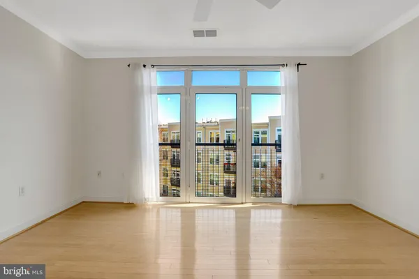 wooden floor and window in an empty room