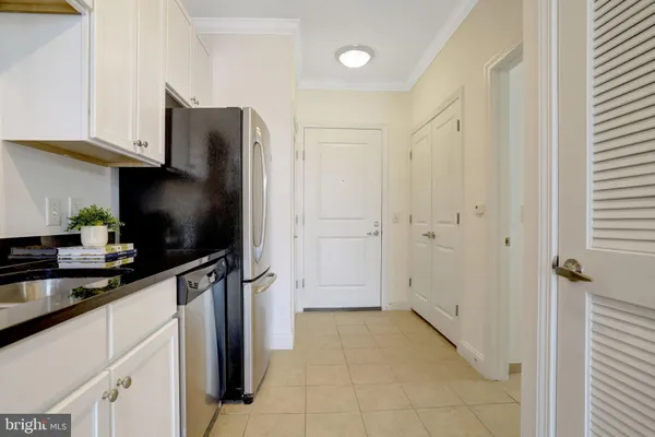 a kitchen with stainless steel appliances a refrigerator and a sink