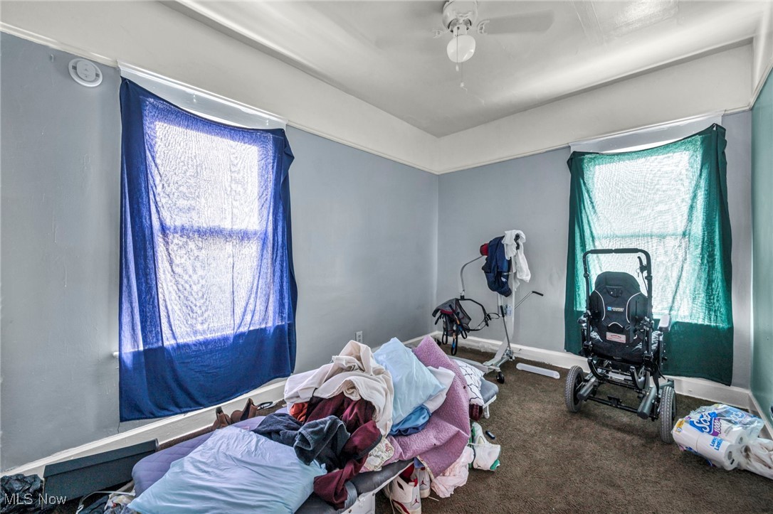738 Eddy Road Cleveland, OH 44108 - Photo 24 of 33 Bedroom with a ceiling fan and carpet flooring