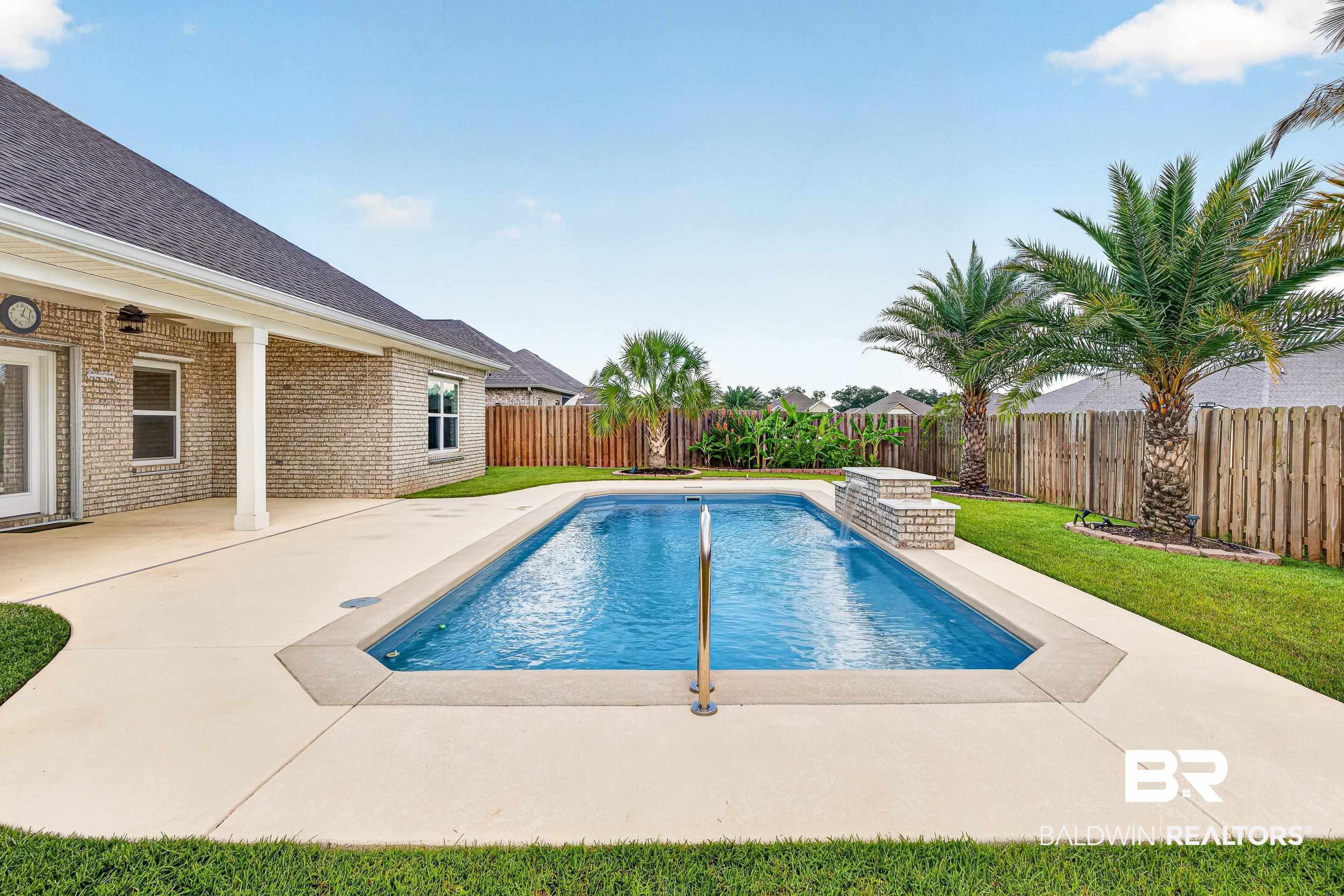 1724 Partridge Street Foley, AL 36535 - Photo 55 of 62 Rectangular swimming pool with a surrounding concrete patio