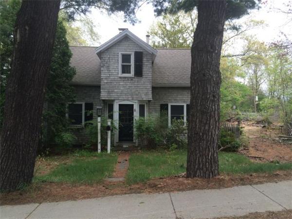 65 Deforest Road Newton, MA 02462 - Photo 6 of 9 a front view of a house with garden