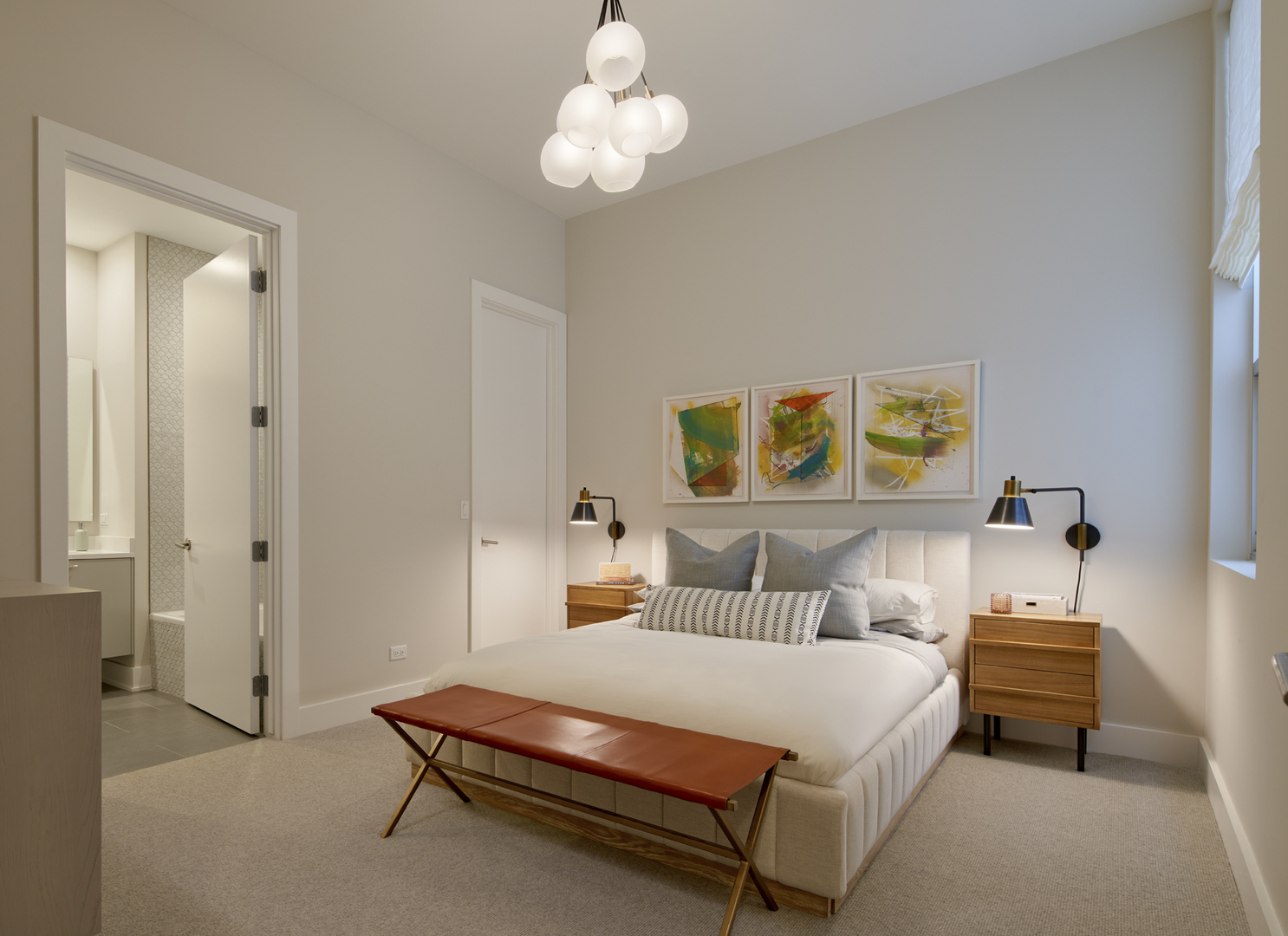 128 South Aberdeen Street, Unit 3S Chicago, IL 60607 - Photo 8 of 9 a bedroom with a bed and a chandelier