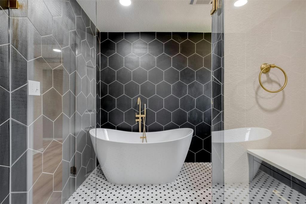 2550 FM 972 Georgetown, TX 78626 - Photo 13 of 29 a white bath tub sitting in a bathroom