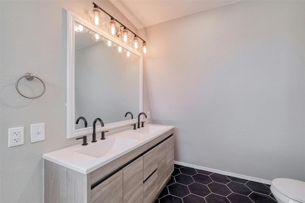 2550 FM 972 Georgetown, TX 78626 - Photo 15 of 29 a bathroom with a double vanity sink and a mirror