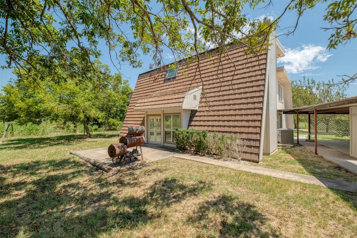 2550 FM 972 Georgetown, TX 78626 - Photo 19 of 29 a view of a house with backyard and sitting area