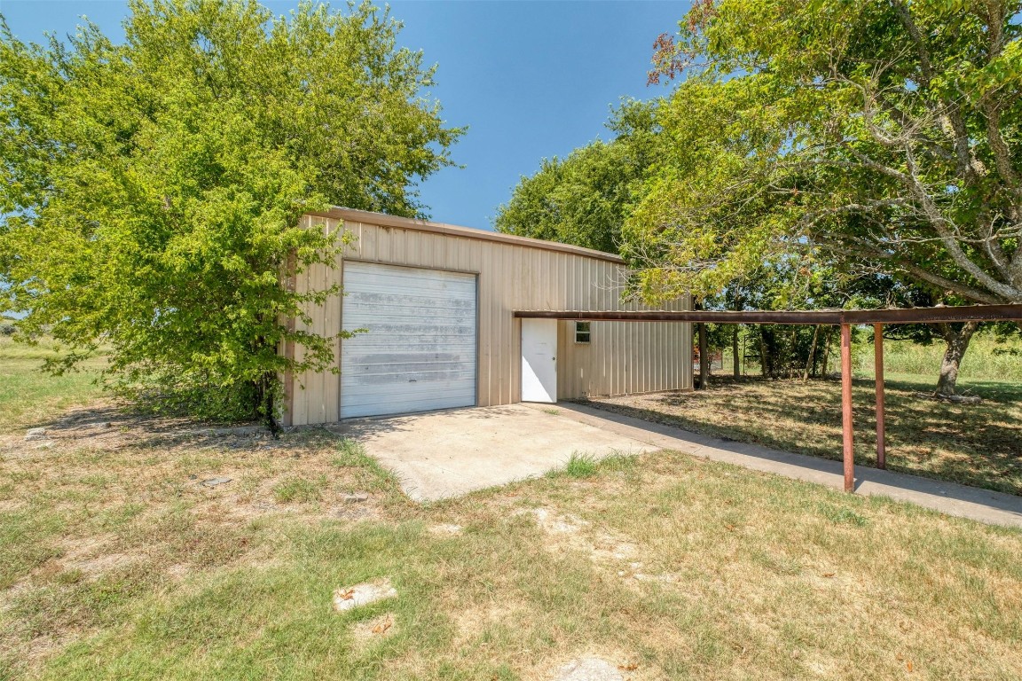 2550 FM 972 Georgetown, TX 78626 - Photo 20 of 29 a view of a house with a tree and wooden fence