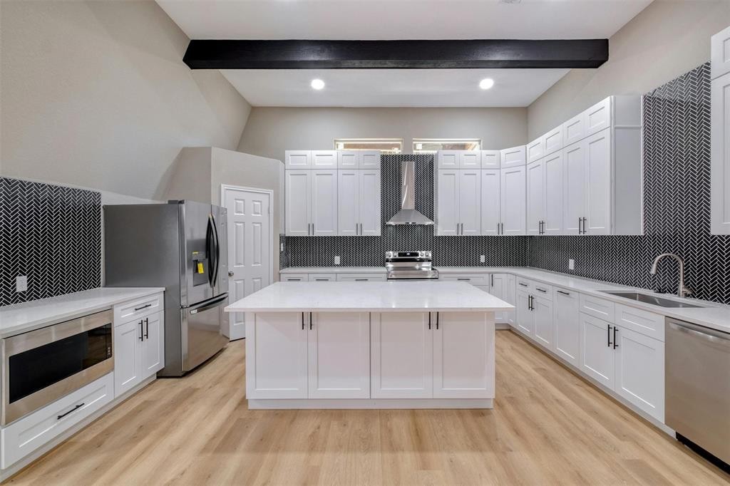 2550 FM 972 Georgetown, TX 78626 - Photo 9 of 29 a large white kitchen with cabinets