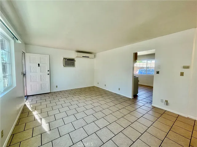 a view of a hallway view with wooden floor and staircase