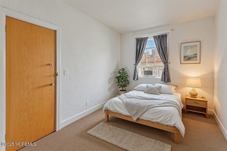 17 Leroy Place, Unit 3B Red Bank, NJ 07701 - Photo 14 of 36 a bedroom with a bed and a window