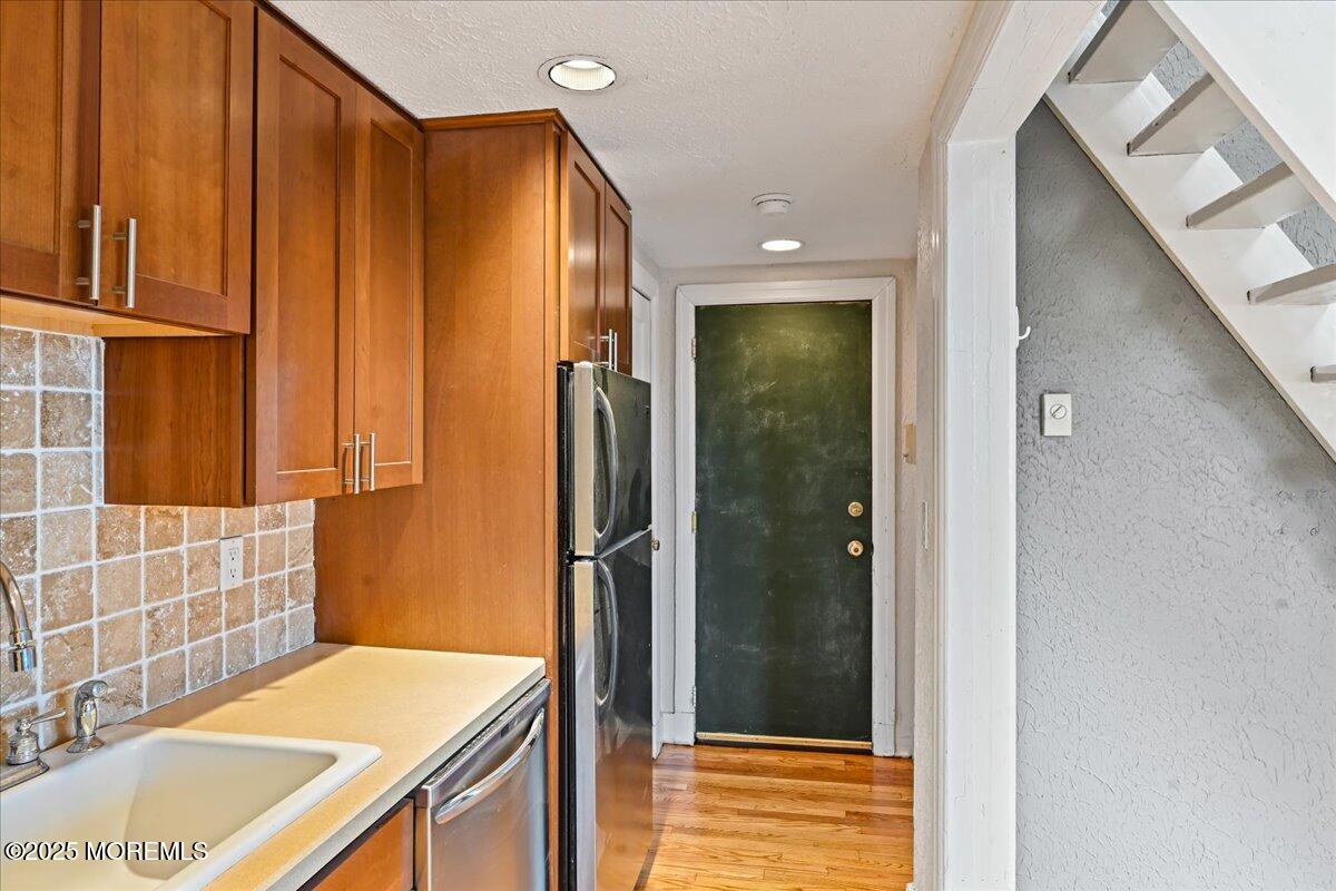 17 Leroy Place, Unit 3B Red Bank, NJ 07701 - Photo 6 of 36 a bathroom with a sink and a mirror