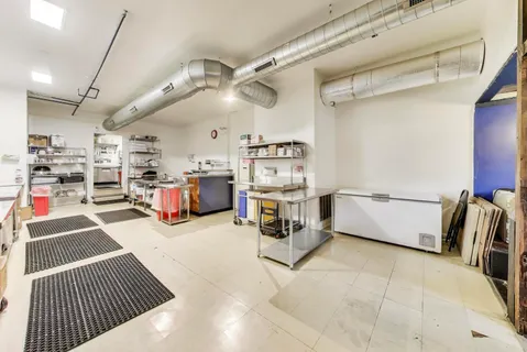 a utility room with lots of appliances and furniture