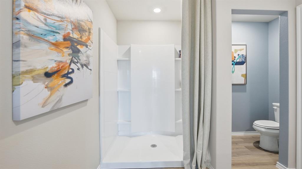 1616 Tin Roof Road Krum, TX 76249 - Photo 16 of 35 a bathroom with a shower and a toilet