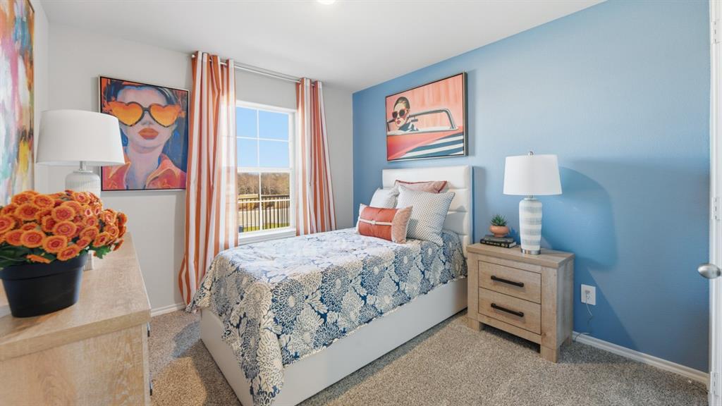 1616 Tin Roof Road Krum, TX 76249 - Photo 19 of 35 a bedroom with a bed and a potted plant