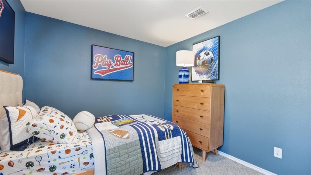 1616 Tin Roof Road Krum, TX 76249 - Photo 26 of 35 a bedroom with a bed and window