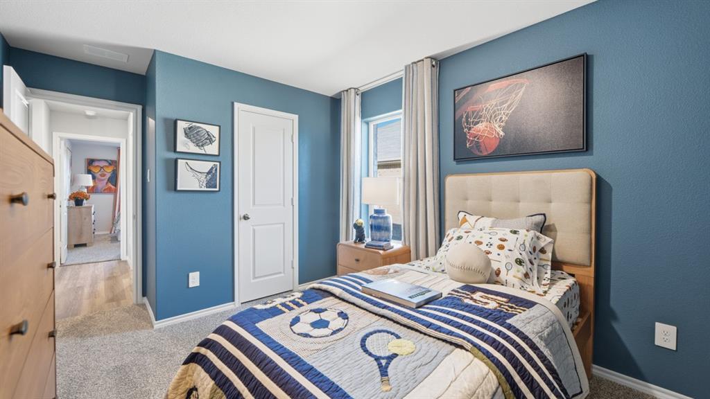 1616 Tin Roof Road Krum, TX 76249 - Photo 27 of 35 a bedroom with a bed and a painting on the wall