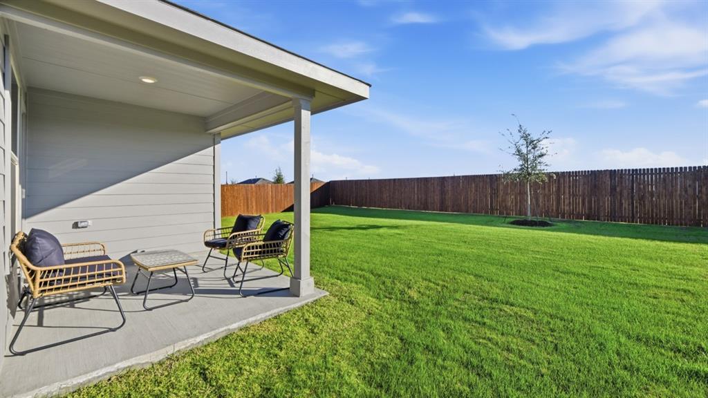 1616 Tin Roof Road Krum, TX 76249 - Photo 31 of 35 a garden view with a seating space