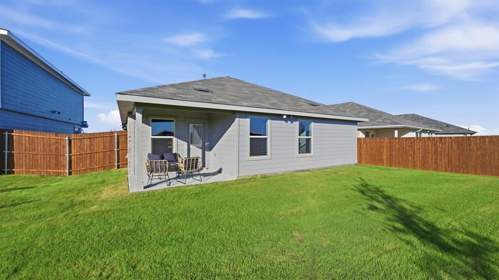 1616 Tin Roof Road Krum, TX 76249 - Photo 34 of 35 a view of a house with backyard porch and garden