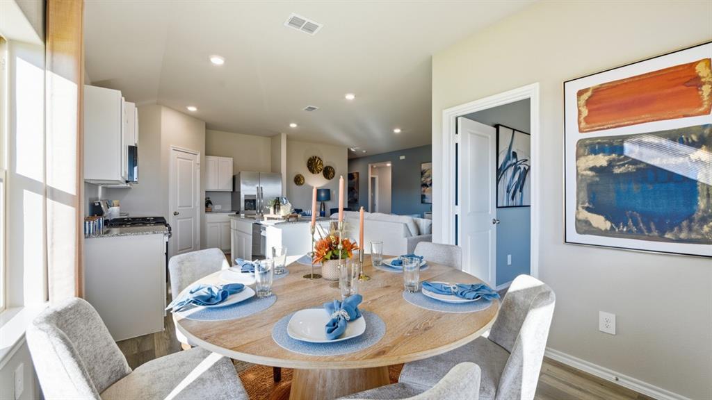 1616 Tin Roof Road Krum, TX 76249 - Photo 7 of 35 a dining room with furniture a large window and kitchen view
