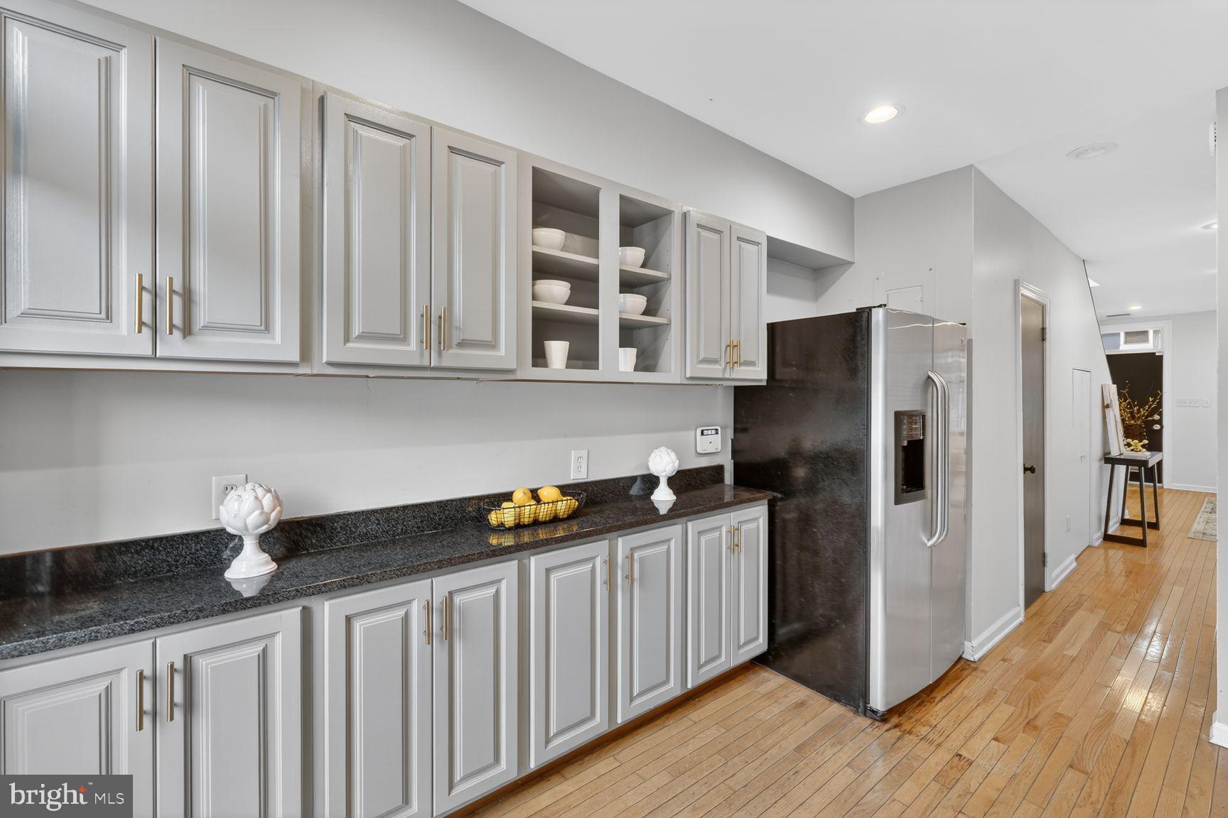 624 14th Place Northeast Washington, DC 20002 - Photo 11 of 25 a kitchen with stainless steel appliances granite countertop a refrigerator and a sink