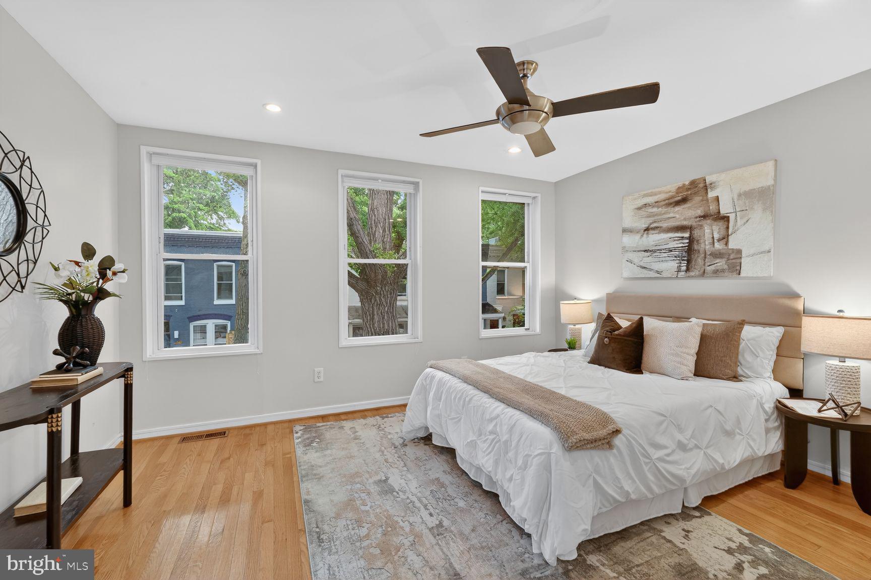 624 14th Place Northeast Washington, DC 20002 - Photo 15 of 25 a bedroom with a large bed and two windows