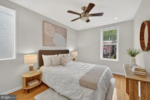 a bedroom with a large bed and a window