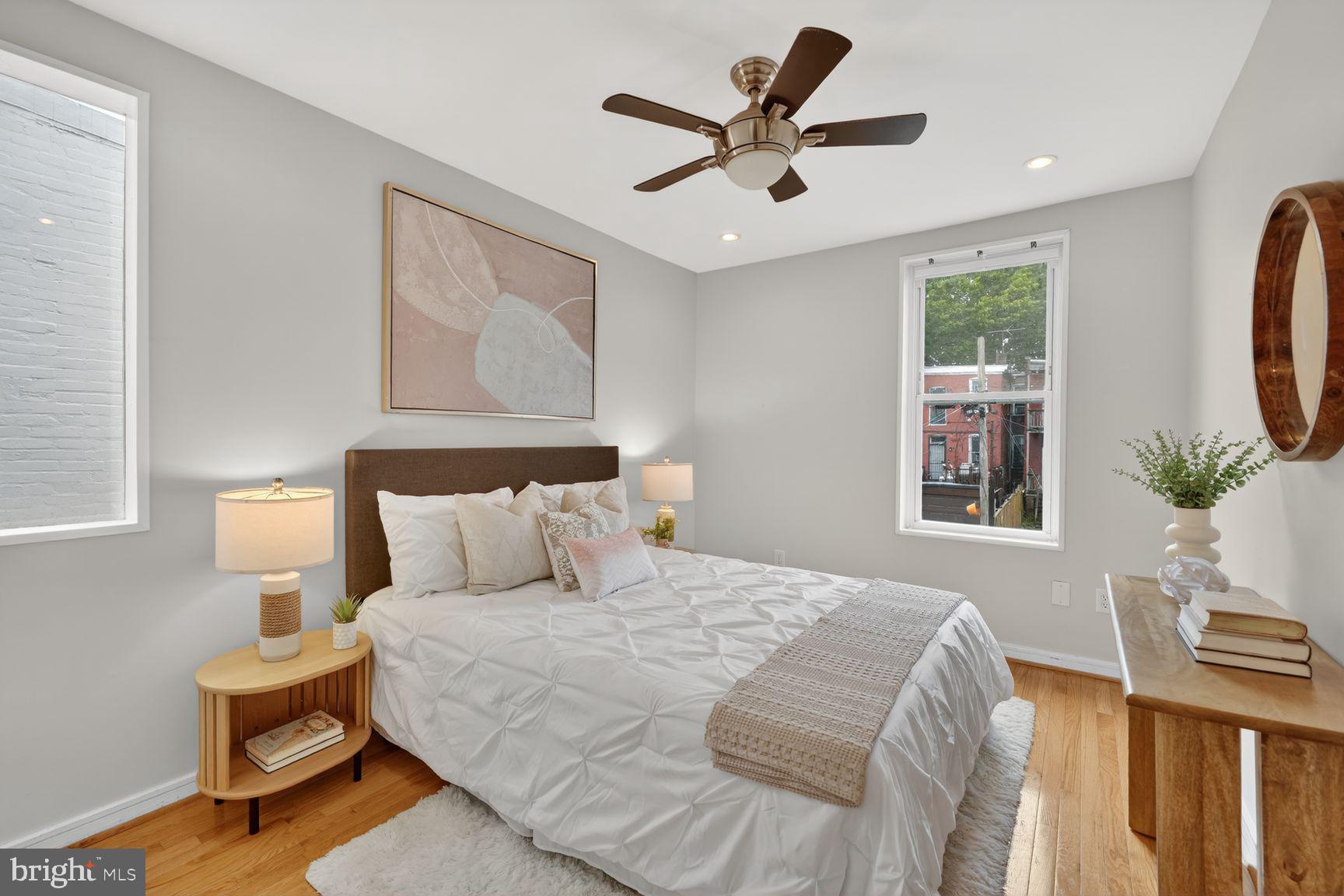 624 14th Place Northeast Washington, DC 20002 - Photo 18 of 25 a bedroom with a large bed and a window