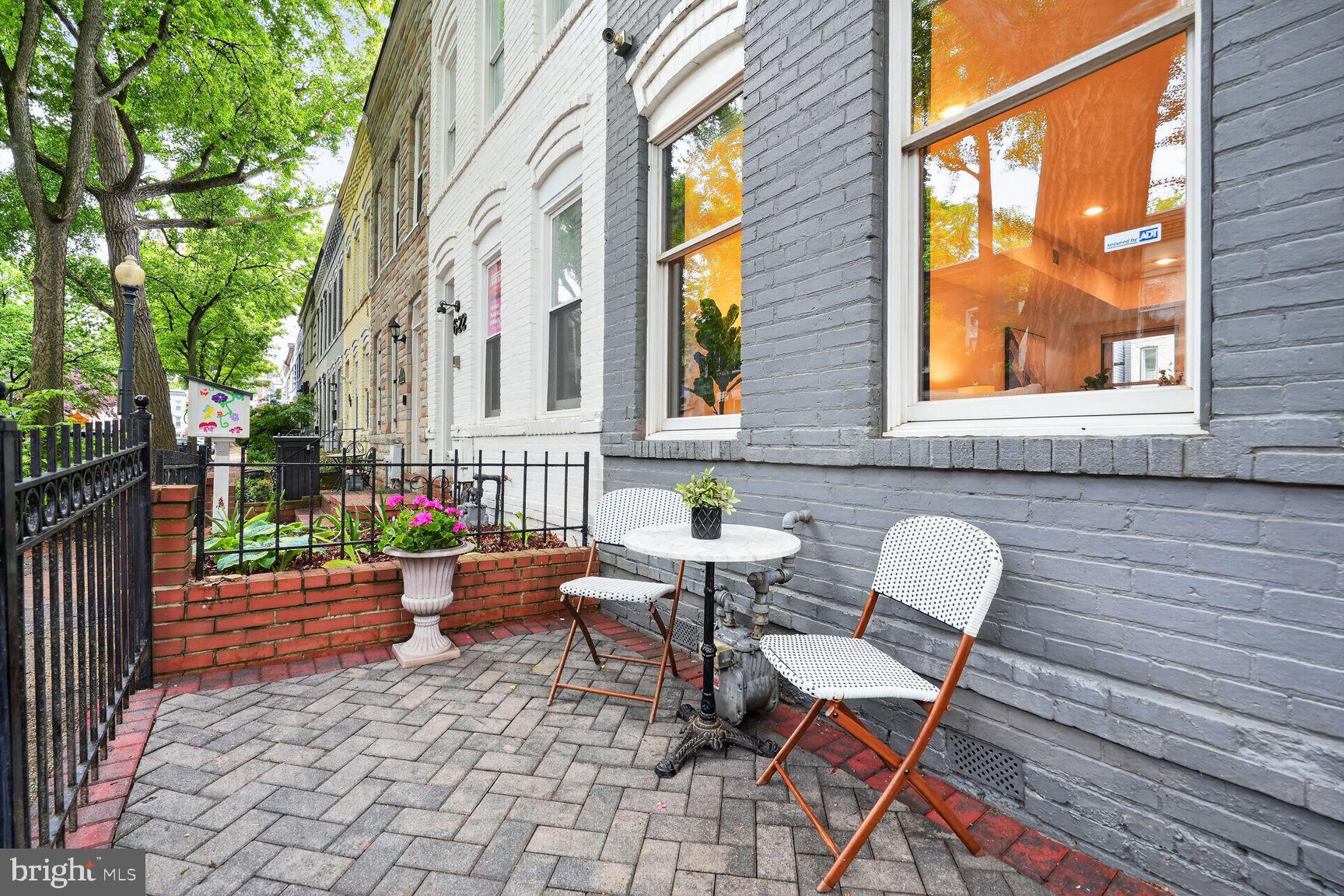 624 14th Place Northeast Washington, DC 20002 - Photo 2 of 25 a backyard of a house with wooden floor chairs and wooden fence